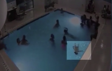 Hotel footage captures moment two-year-old boy saved by off-duty nurses after nearly drowning