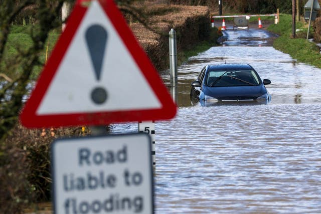 A car is stuck in flood water near Peasmarsh, Somerset, on Thursday February 13, 2020.