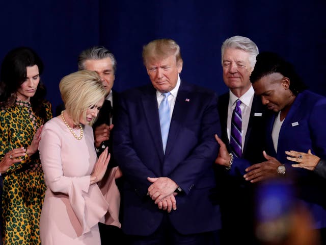 Trump appointed televangelist Paula White [2nd from left] as a faith adviser in the White House