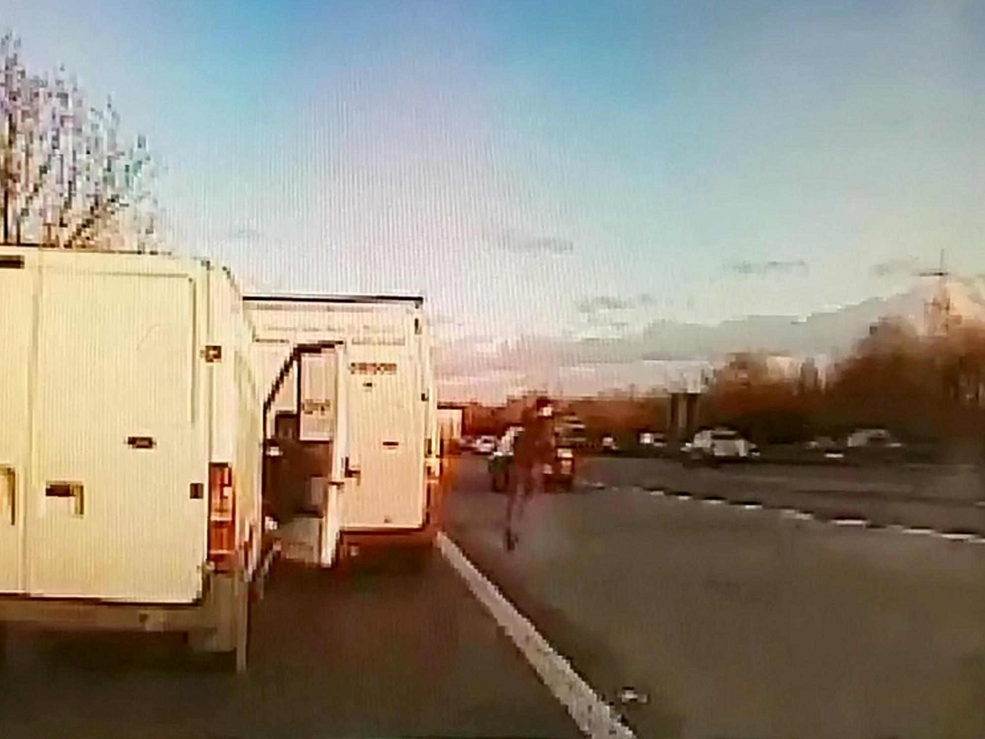 Dashcam footage shows moment thief escaped from cops - by sprinting across six lanes of motorway traffic