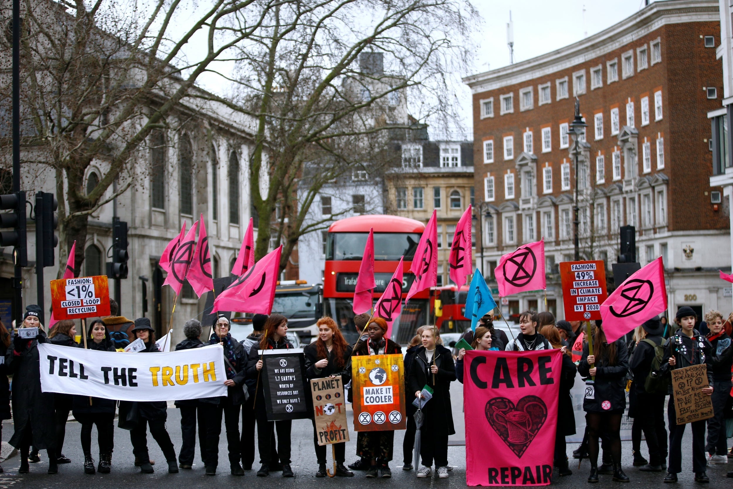 Activists block a road in central London yesterday to protest about ‘false fashion’ (Reuters)