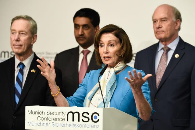 Nancy Pelosi, centre, was one of those to lament the lack of a UK minister in Munich