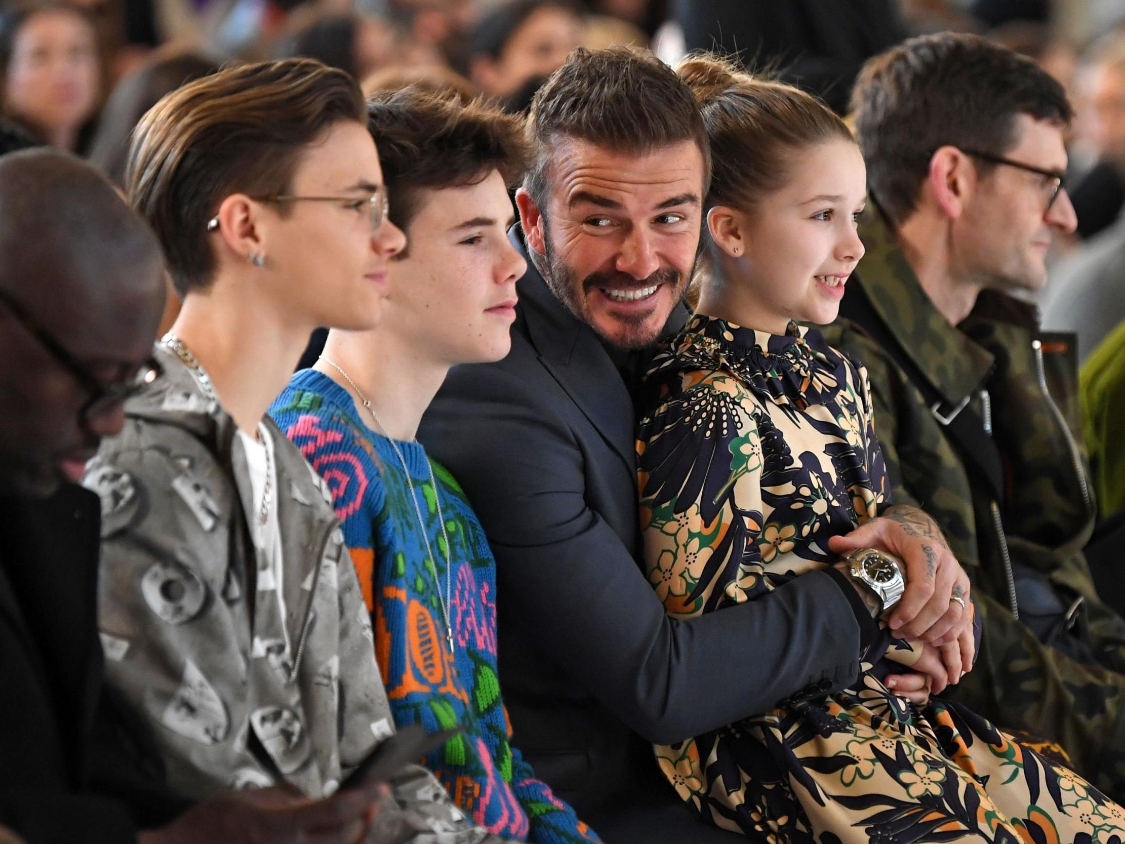 The Beckhams look on in support of Victoria