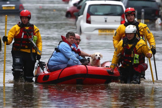 Residents and pets are evacuated from flooded homes in Nantgarw, South Wales