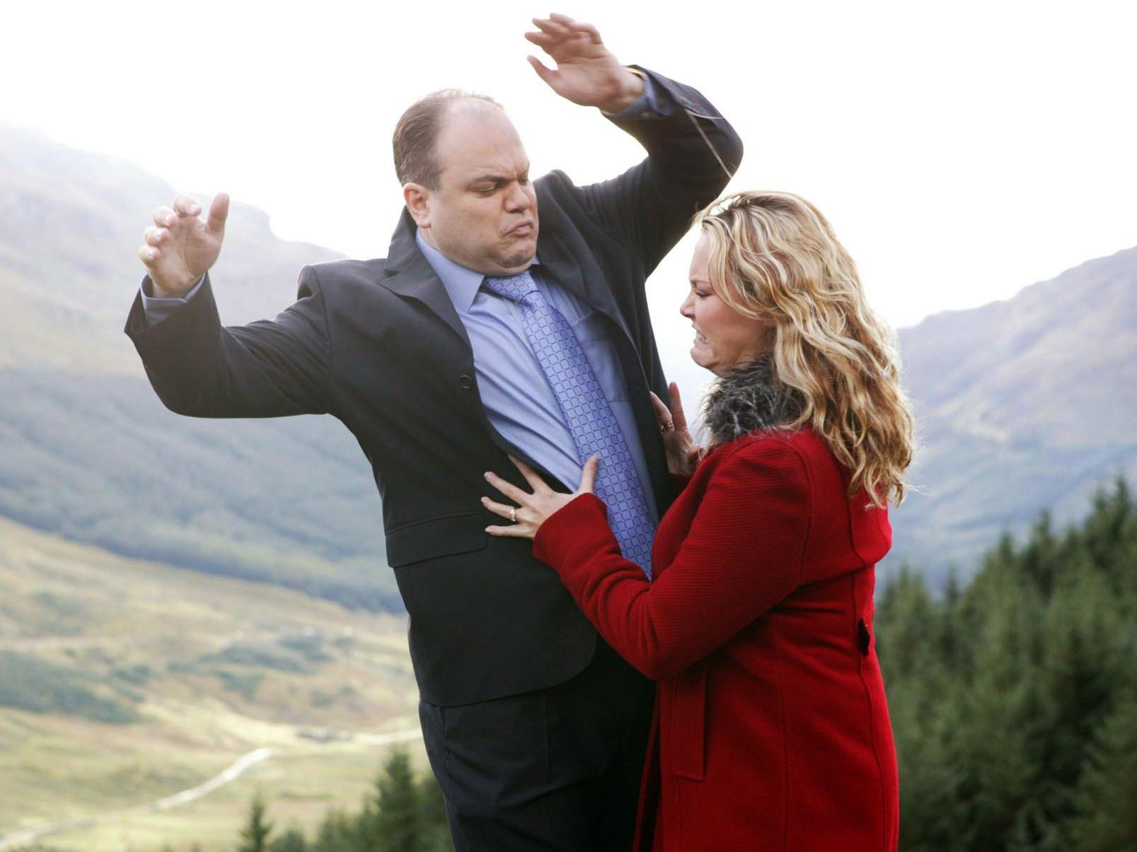 Down he goes: Barry (Shaun Williamson) is pushed off a cliff by his new bride Janine (Charlie Brooks) in a memorable 2003 episode of EastEnders