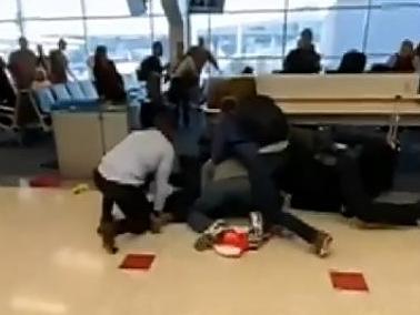 Bystanders captured footage of altercation which saw man take a swing at airport security
