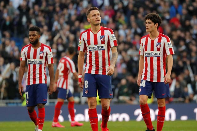 Atletico Madrid's Saul Niguez looks dejected