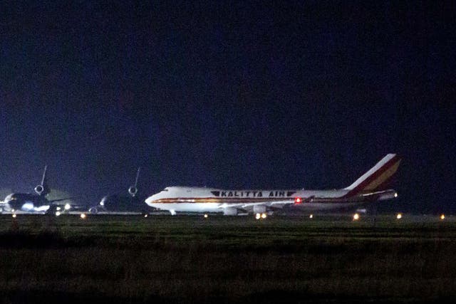 A plane carrying American passengers, who were recently released from the Diamond Princess cruise ship in Japan, arrives at Travis Air Force Base in California