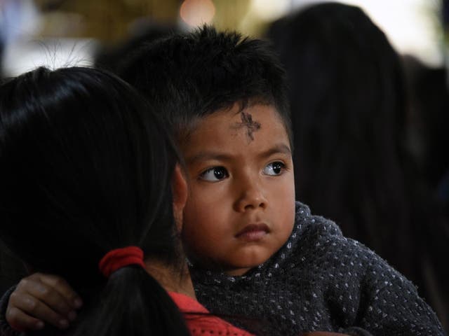 Catholic parishioners participate in the traditional Ash Wednesday ceremony at San Juan Sacatepequez's church, 30 kilometres northwest of Guatemala City on 6 March 2019