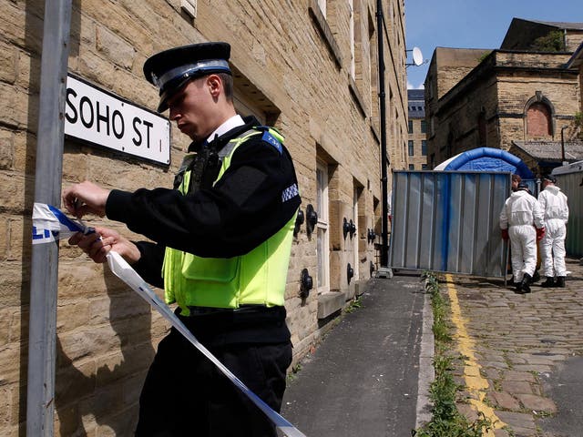 Police carrying out a fingertip search outside Griffiths' home 