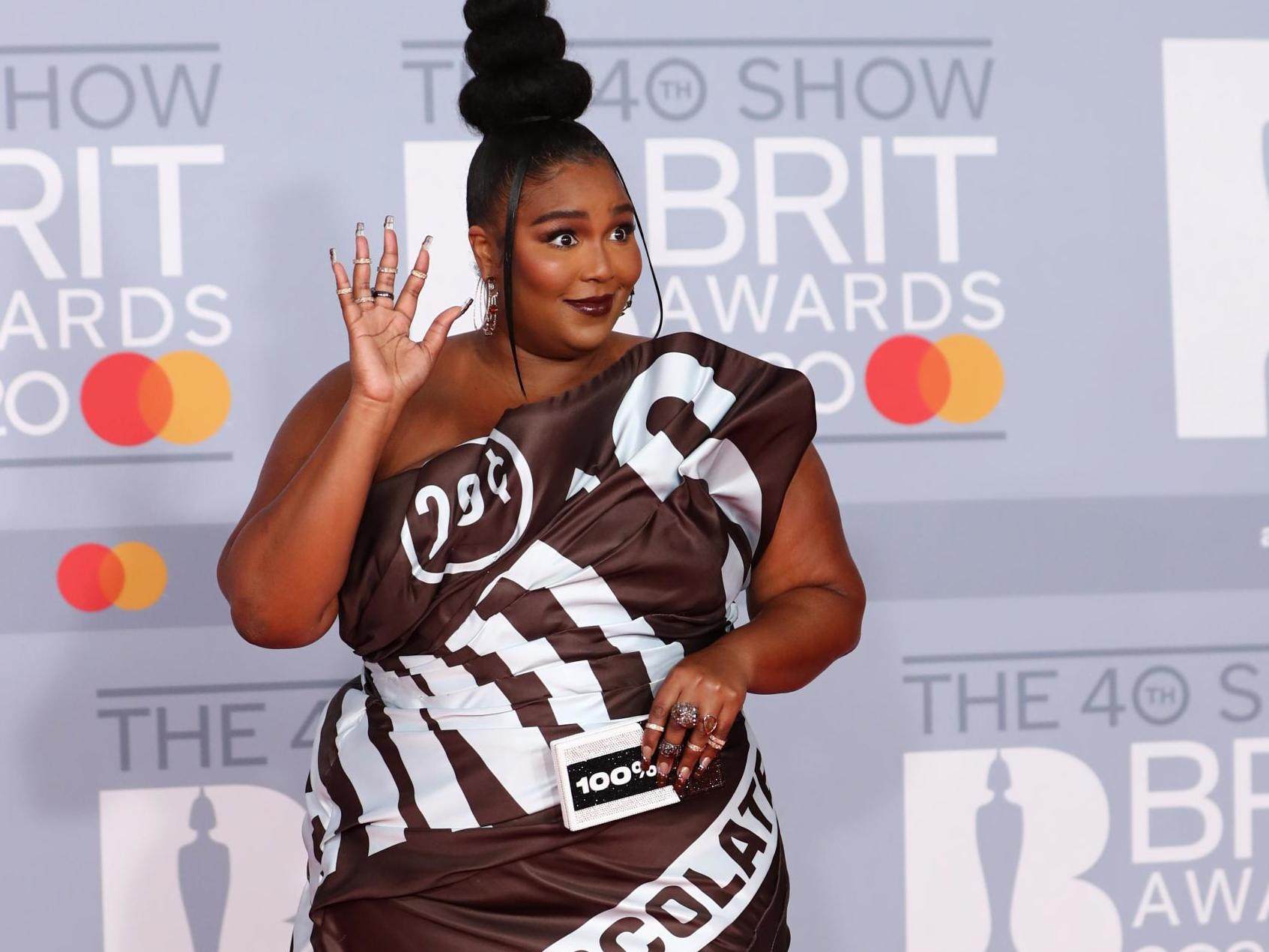 Brit Awards: Lizzo wears chocolate wrapper dress on the red carpet ...