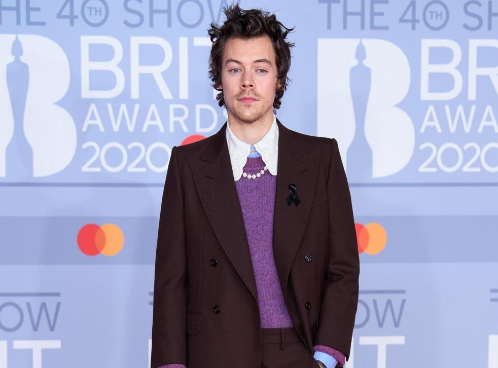 Harry Styles appears to honour Caroline Flack with black ribbon at Brit ...