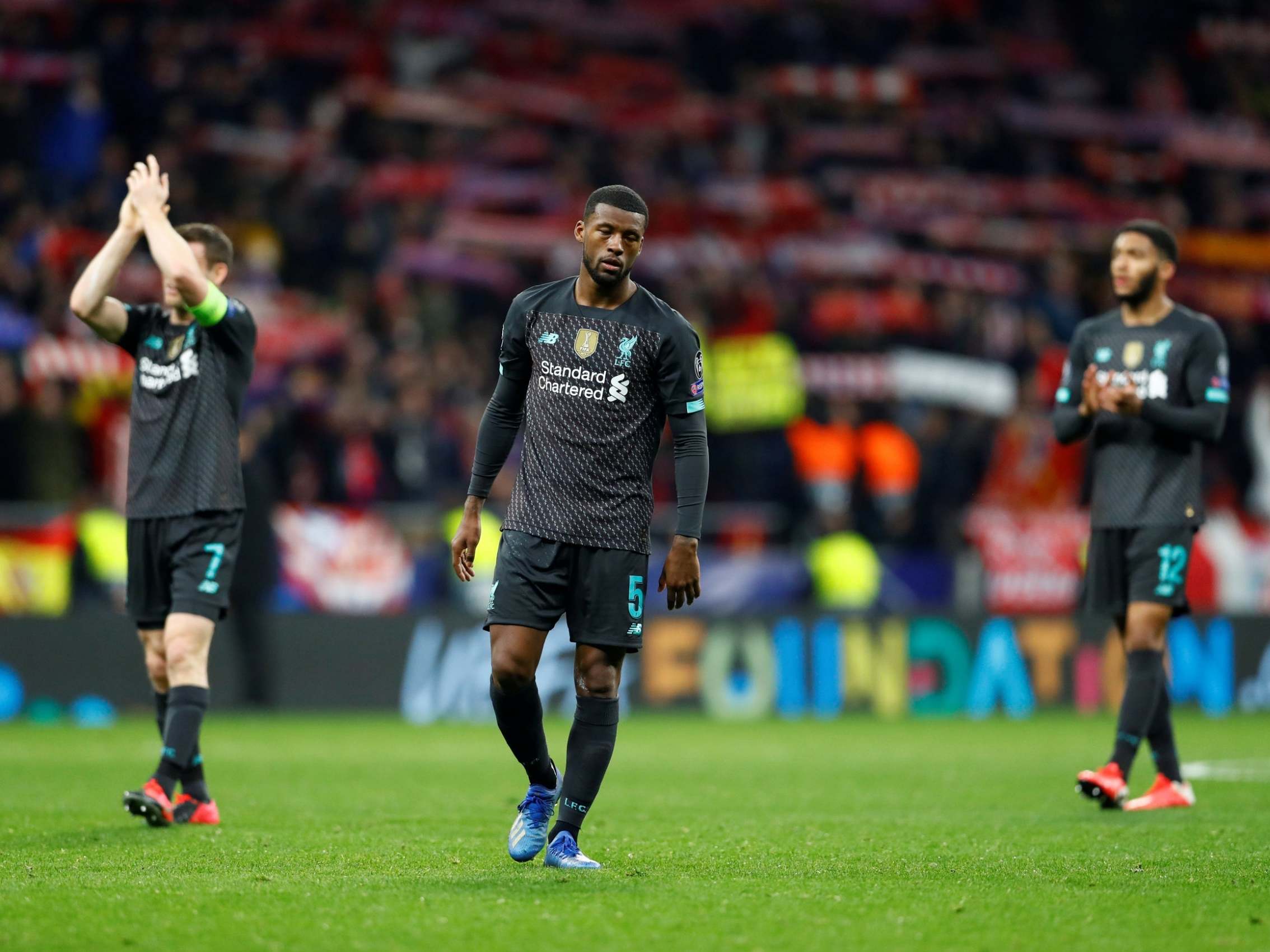 Liverpool's Georginio Wijnaldum looks dejected after defeat in Madrid