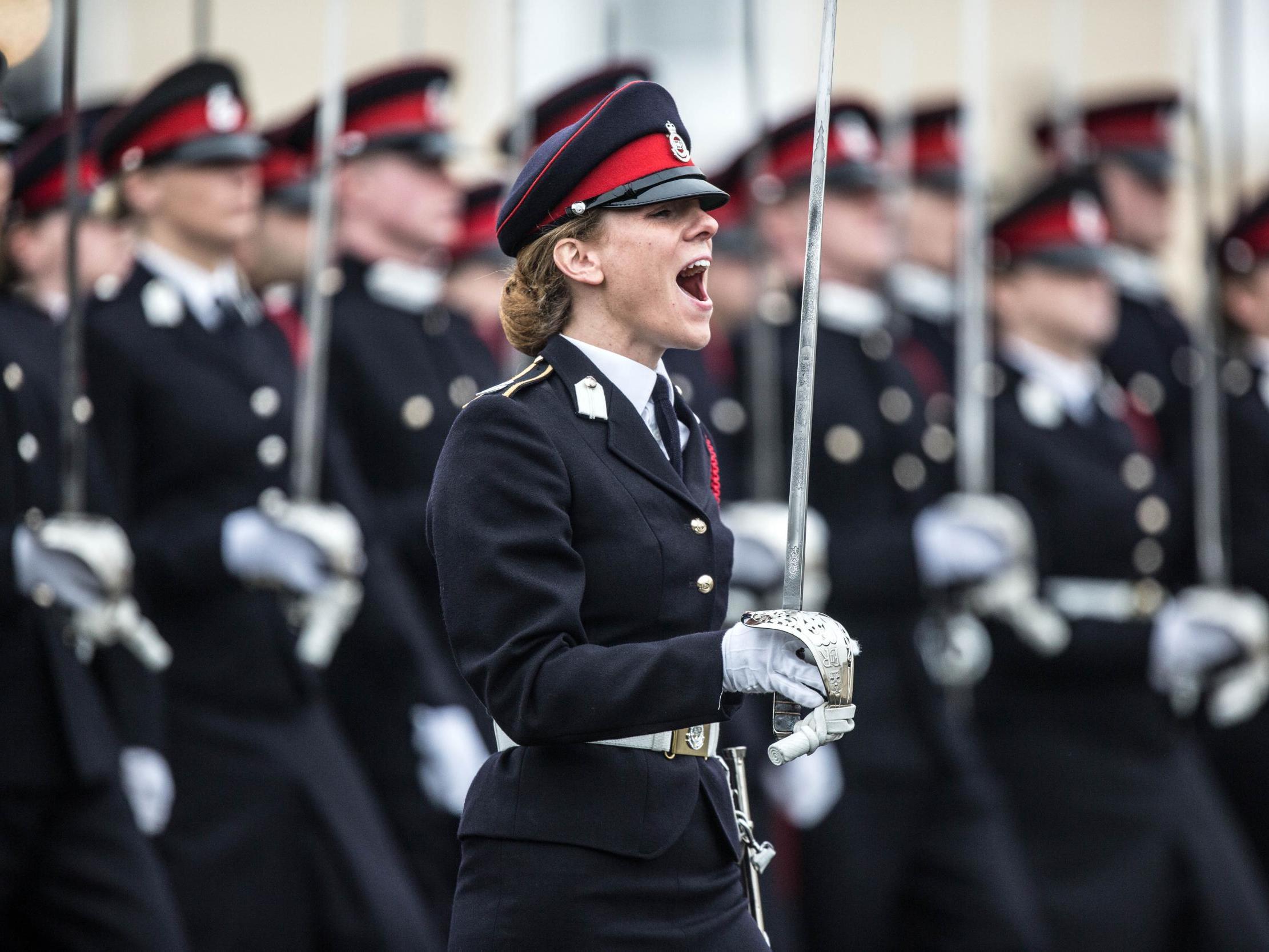 British Army officer Captain Rosie Wild shouts commands during the Officer Cadets march at Sandhurst after receiving the Sword of Honour, 16 December, 2016.