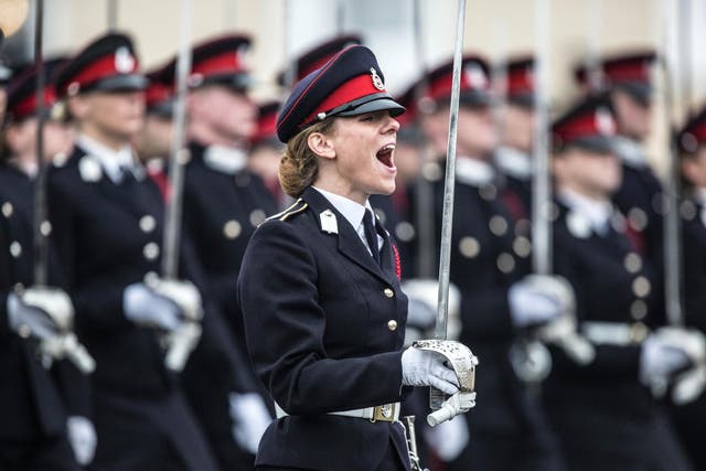 British Army officer Captain Rosie Wild shouts commands during the Officer Cadets march at Sandhurst after receiving the Sword of Honour, 16 December, 2016.