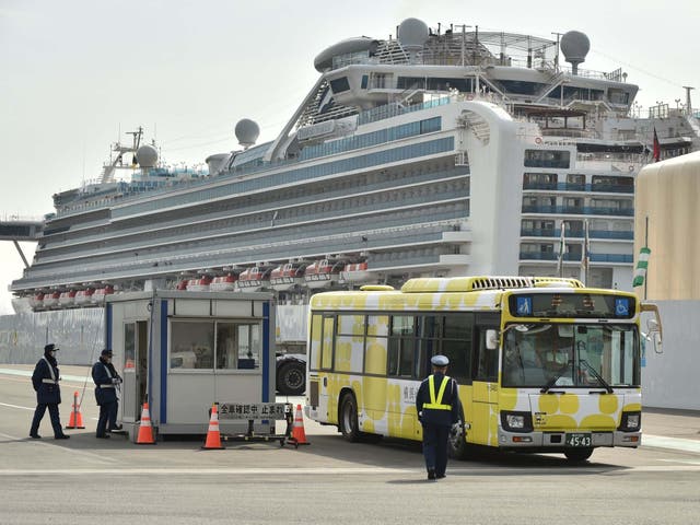 A bus carrying passengers who disembarked from the Diamond Princess cruise ship, which is in quarantine in Yokohama, Japan, following an outbreak of the new COVID-19 coronavirus, 20 February, 2020.