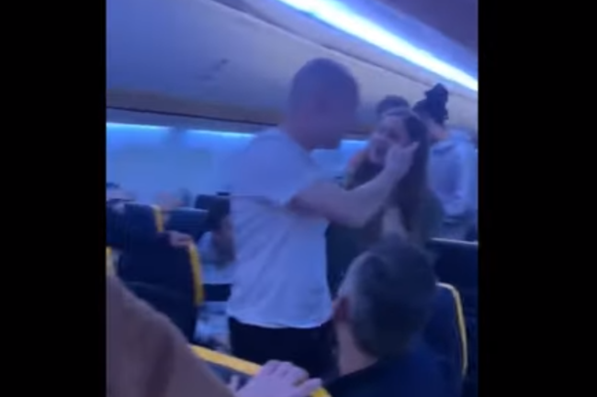 ‘I’ll slap you around’: Angry passengers square up to each other and shout abuse on Ryanair flight