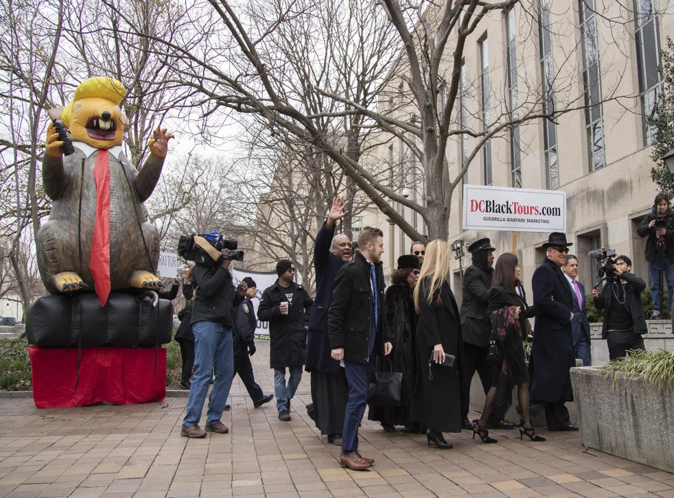 Roger Stone, right, accompanied by his wife Nydia Stone, arrive at federal court in Washington DC on Thursday, 20 February, 2020