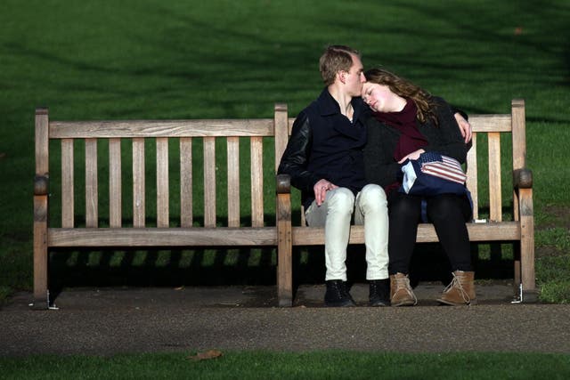 Couple enjoy the sun in Saint James Park London