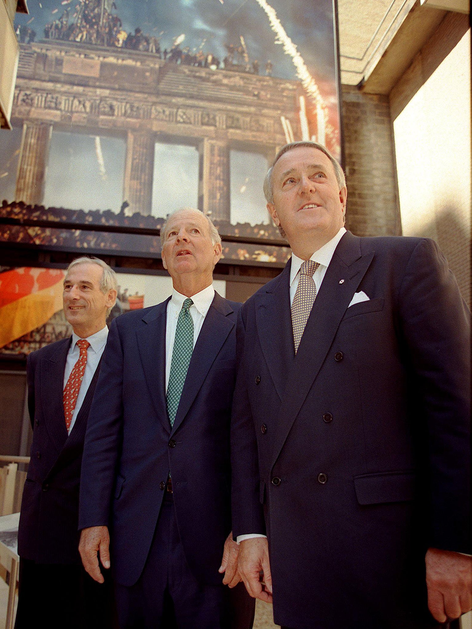 Fukuyama was an aide to former US secretary of state James Baker (centre), here on a tour of the?Berlin Wall exhibit?in Freedom Park in 1999?(AFP/Getty)