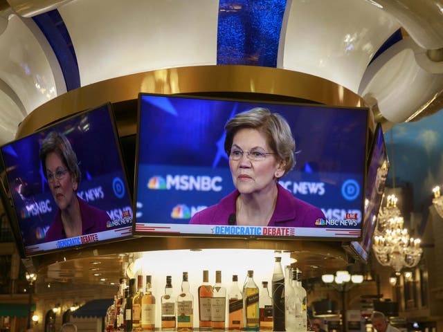 A television image of democratic presidential hopeful Elizabeth Warren is shown in a bar at a casino near the Paris Theater during the Nevada Debate in Las Vegas