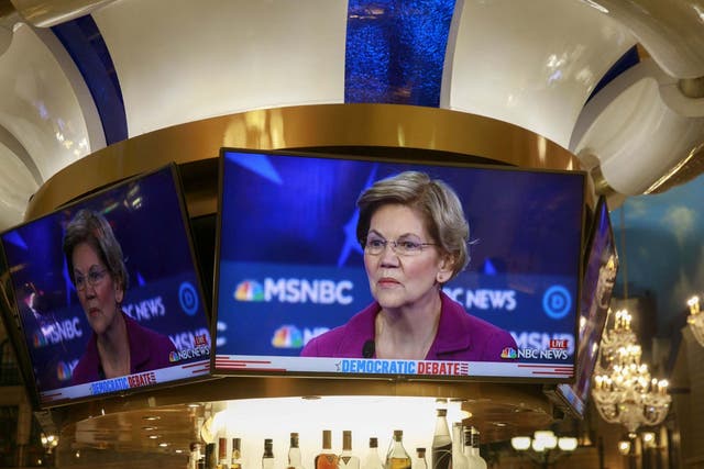 A television image of democratic presidential hopeful Elizabeth Warren is shown in a bar at a casino near the Paris Theater during the Nevada Debate in Las Vegas