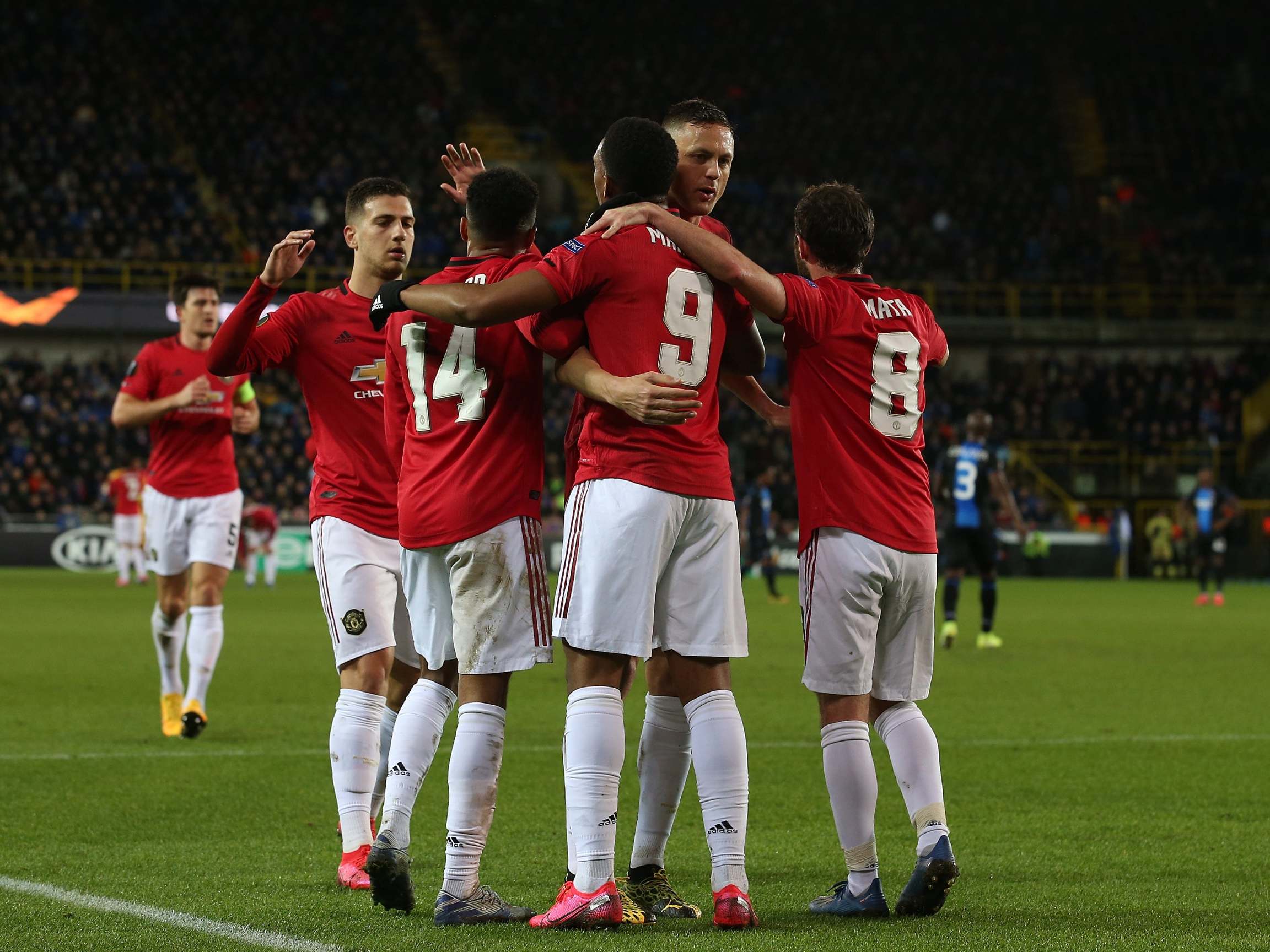 United celebrate after Martial equalises in Bruges