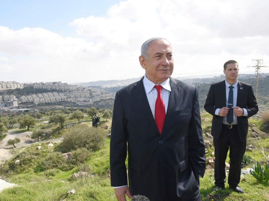Netanyahu stands at an overview of the East Jerusalem settlement of Har Homa where he announced a new neighbourhood is to be built