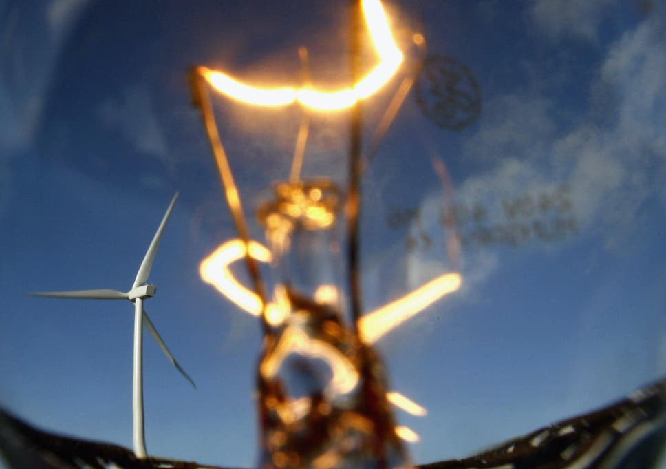 In this photo illustration wind turbines are seen through a light bulb at the Braes of Doune windfarm February 14, 2007 in Stirling, Scotland