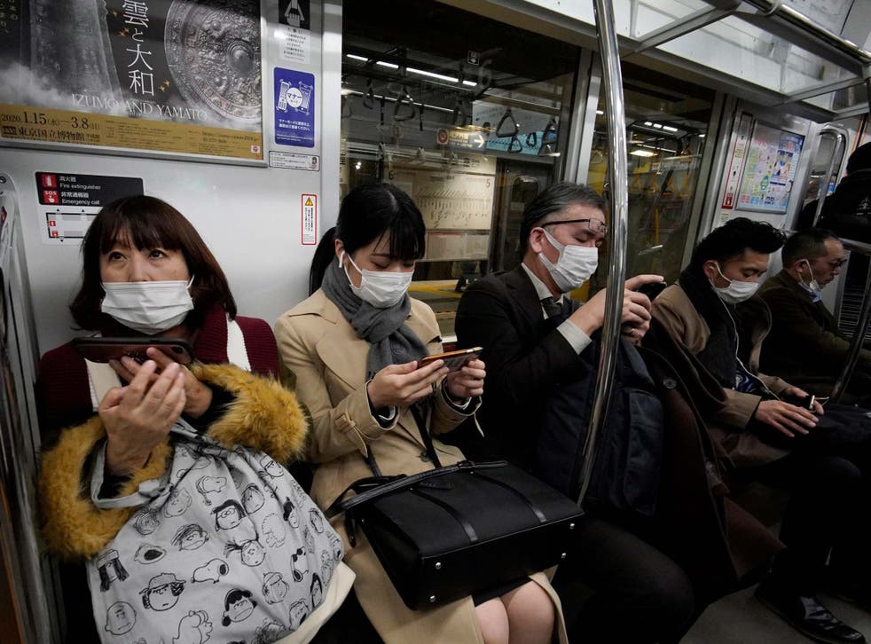 Coronavirus: Japanese man pushes train emergency button 'after passenger without  mask coughs' | The Independent | The Independent