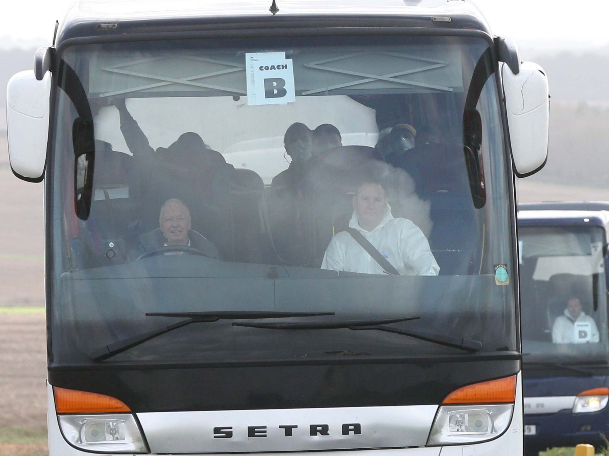 Passengers in coaches leave MoD Boscombe Down in Wiltshire after being repatriated to the UK from a cruise ship hit by the coronavirus in Yokohama