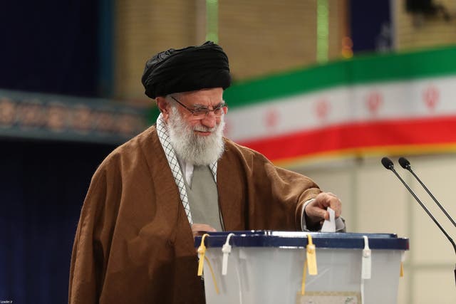 Iran's supreme leader Ayatollah Ali Khamenei casts his ballot in the parliamentary elections at a polling station in Tehran