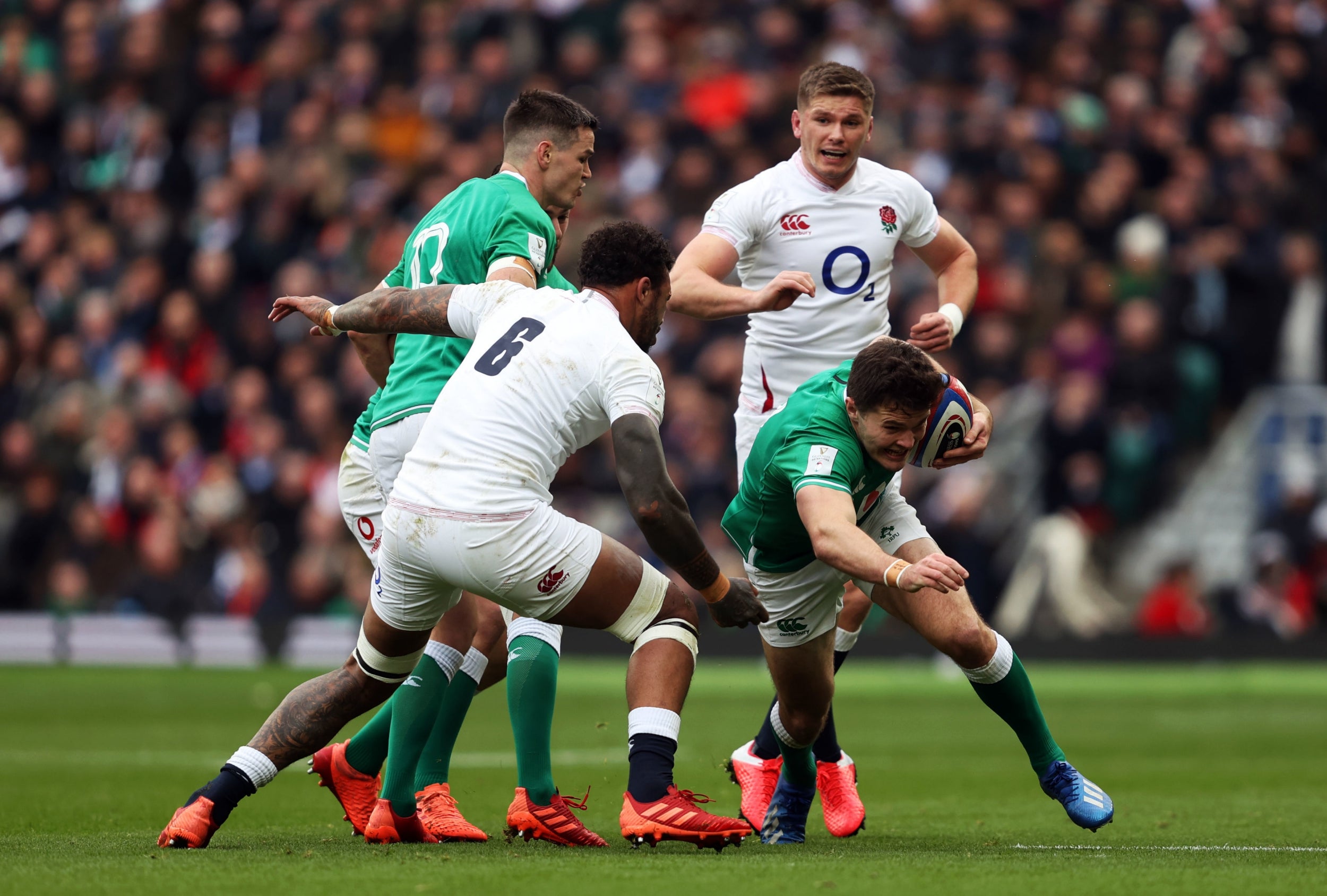 Ireland’s Jacob Stockdale (right) gets away from England’s Courtney Lawes during the game at Twickenham