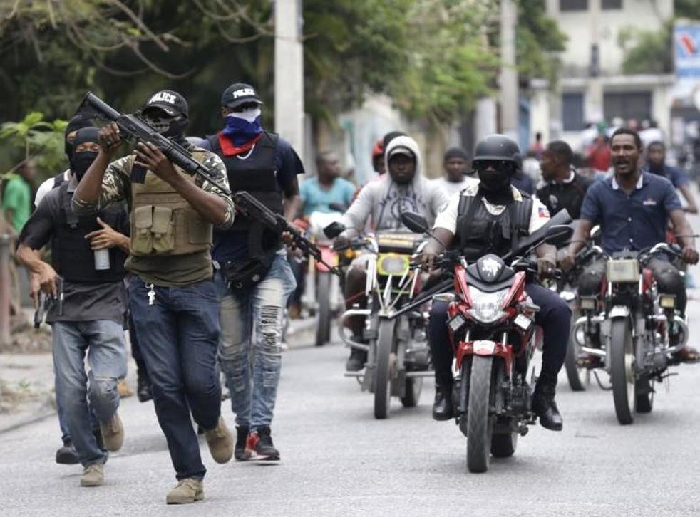 Armed off-duty police officers protest over pay and working conditions, in Port-au-Prince Haiti close to the presidential palace, on 23 February 2020