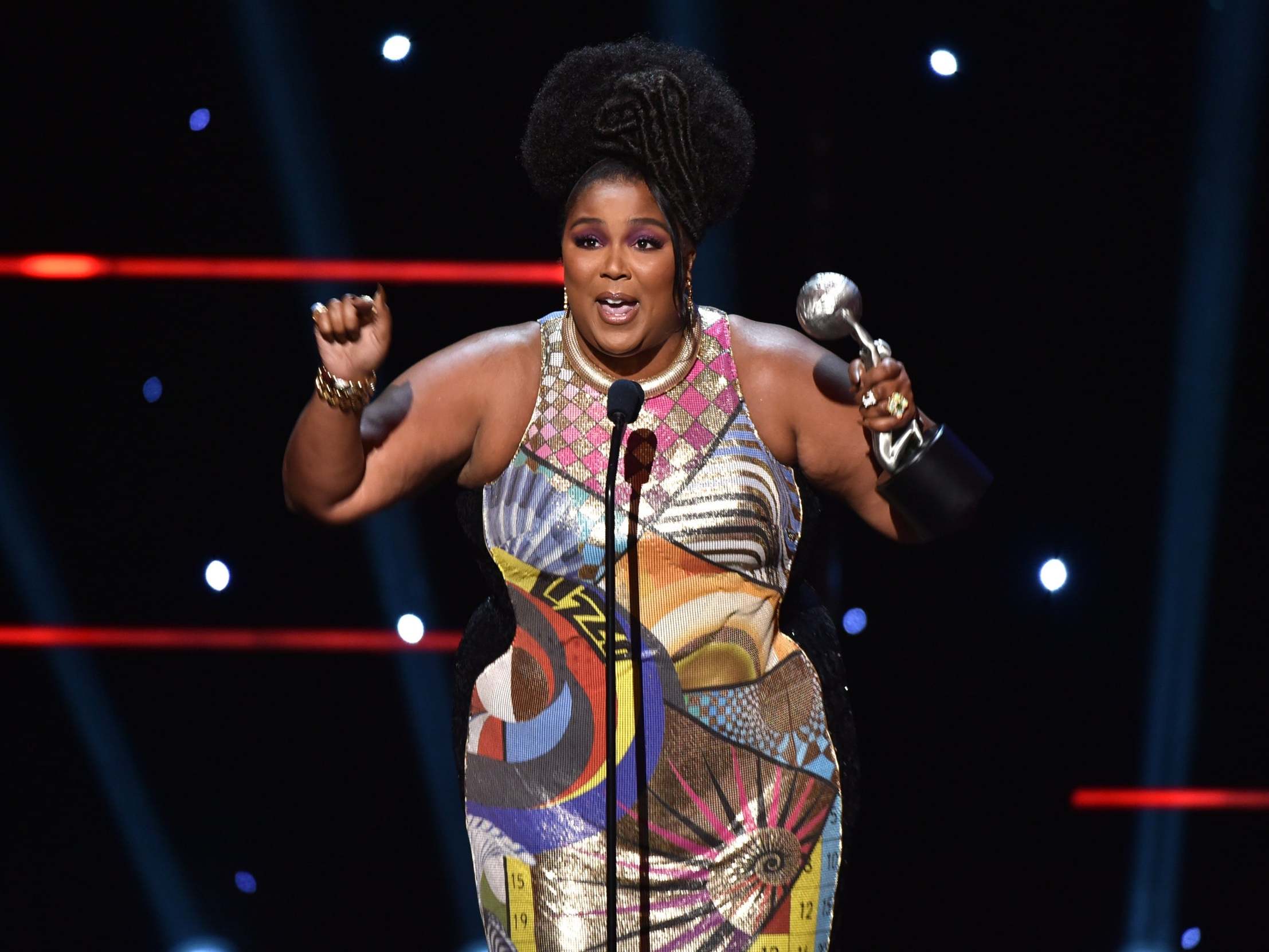 Lizzo accepts her prize for Entertainer of the Year