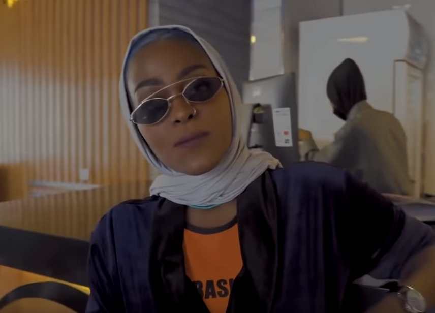 Asayel Slay raps about her pride in being from the holy city in the video