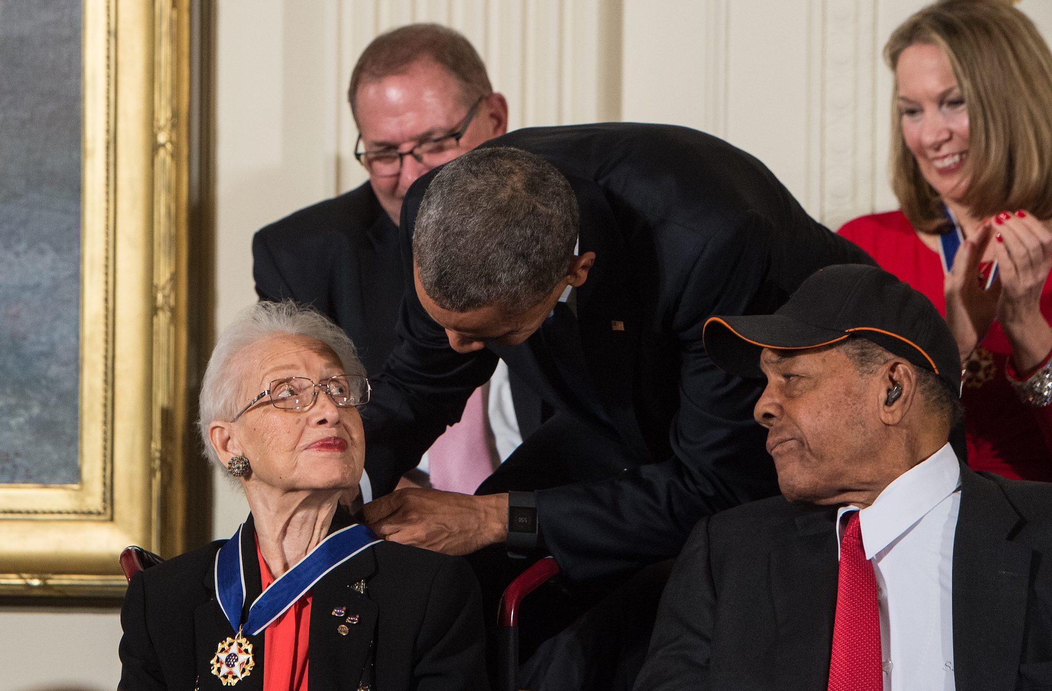 US President Barack Obama presents the Presidential Medal of Freedom to NASA mathematician and physicist Katherine Johnson at the White House in Washington, DC, on November 24, 2015