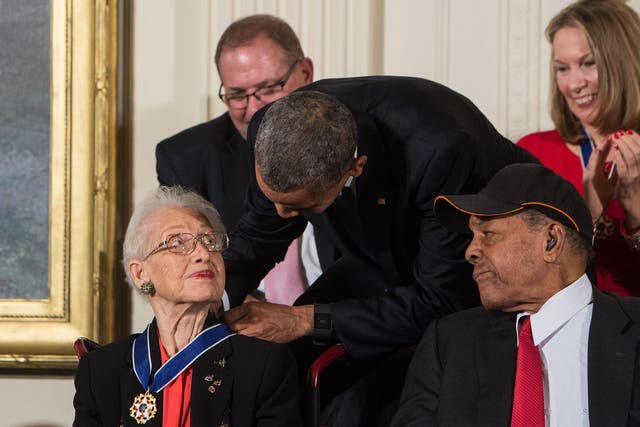 US President Barack Obama presents the Presidential Medal of Freedom to NASA mathematician and physicist Katherine Johnson at the White House in Washington, DC, on November 24, 2015