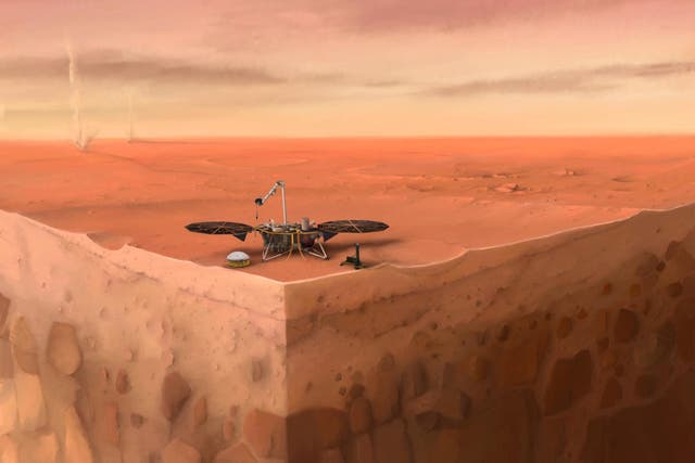 In this artist's concept of NASA's InSight lander on Mars, layers of the planet's subsurface can be seen below and dust devils can be seen in the background
