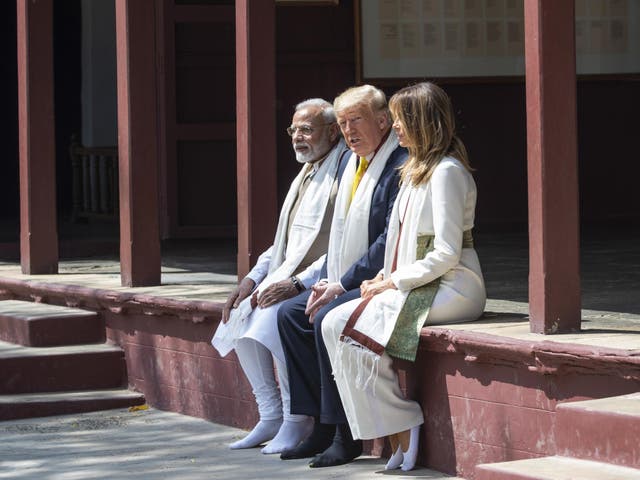 Donald Trump, his wife Melania and the prime minster of India Narendra Modi during their visit to the Gandhi Ashram