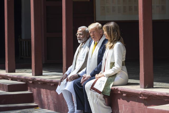 Donald Trump, his wife Melania and the prime minster of India Narendra Modi during their visit to the Gandhi Ashram