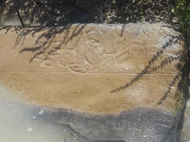 The ancient stone was found by a farmer who was dredging an irrigation ditch