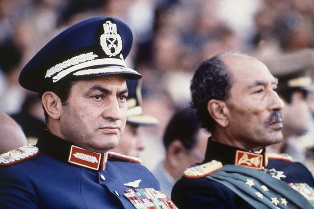 In 1981, Egyptian president Anwar Sadat, right, and vice president Hosni Mubarak watch a military parade just before soldiers opened fire from a truck, killing Sadat 