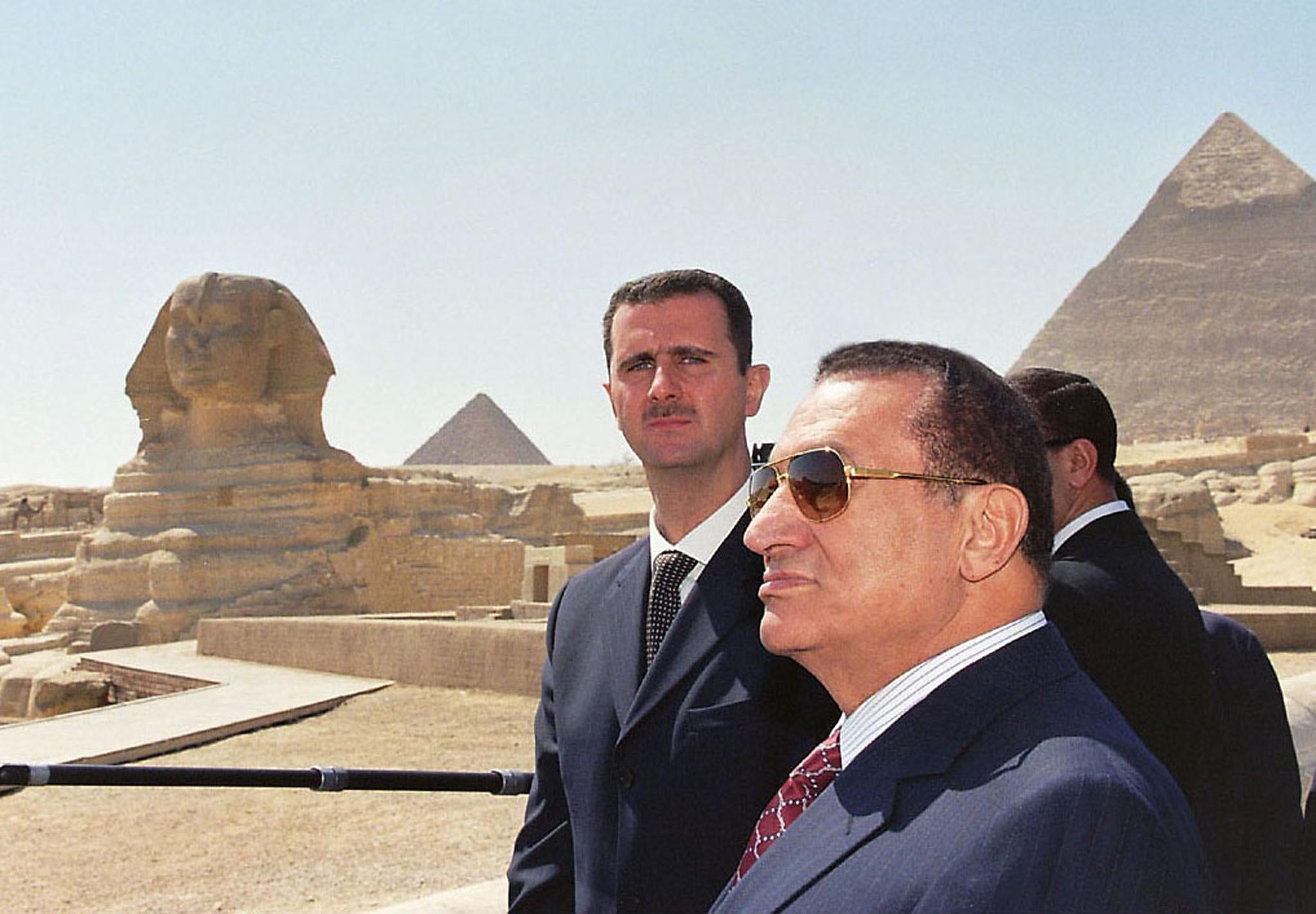 Syrian president Bashar al-Assad (left) visiting the pyramids in Giza with his Egyptian counterpart Hosni Mubarak, in 2002 (AFP/Getty)