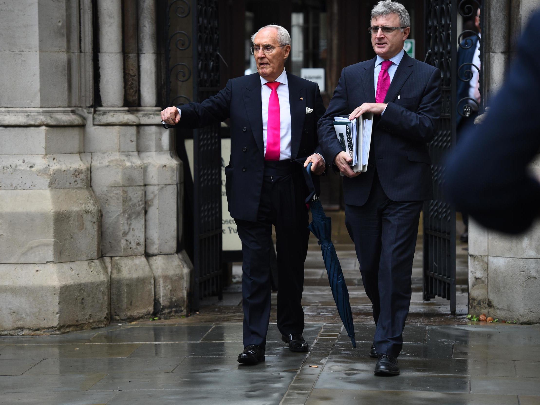Sir Frederick Barclay (left) leaves the High Court in London last year during a separate legal wrangle with his estranged wife