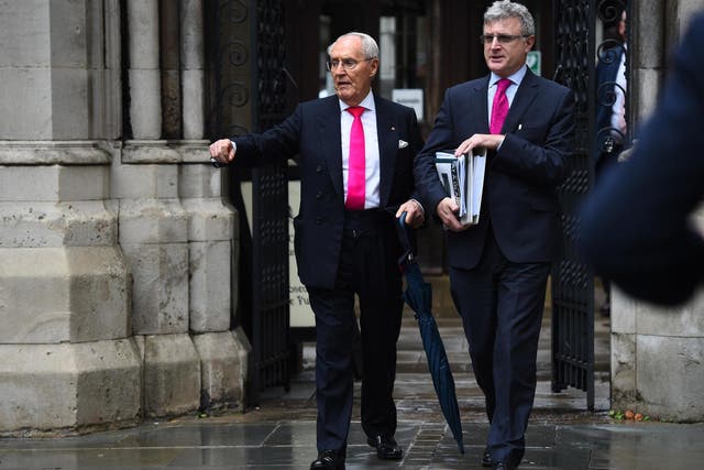 Sir Frederick Barclay (left) leaves the High Court in London last year during a separate legal wrangle with his estranged wife