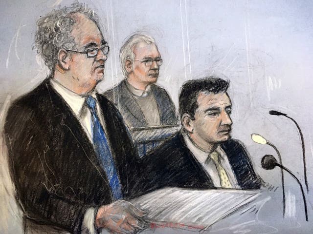 Julian Assange in the dock as his defence team, Edward Fitzgerald QC