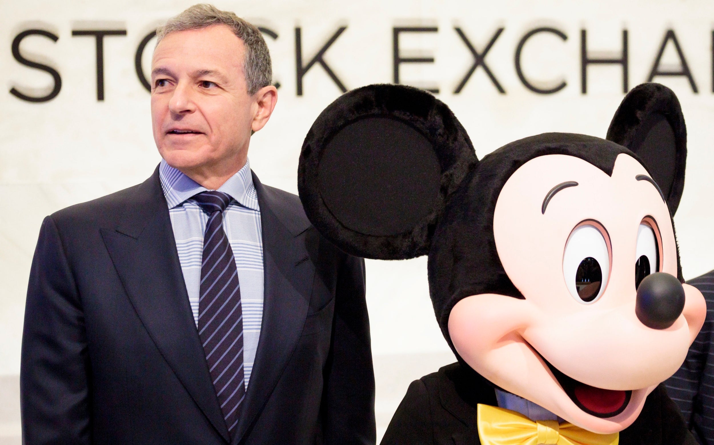 Bob Iger, chief executive officer of Disney, with company mascot Mickey Mouse