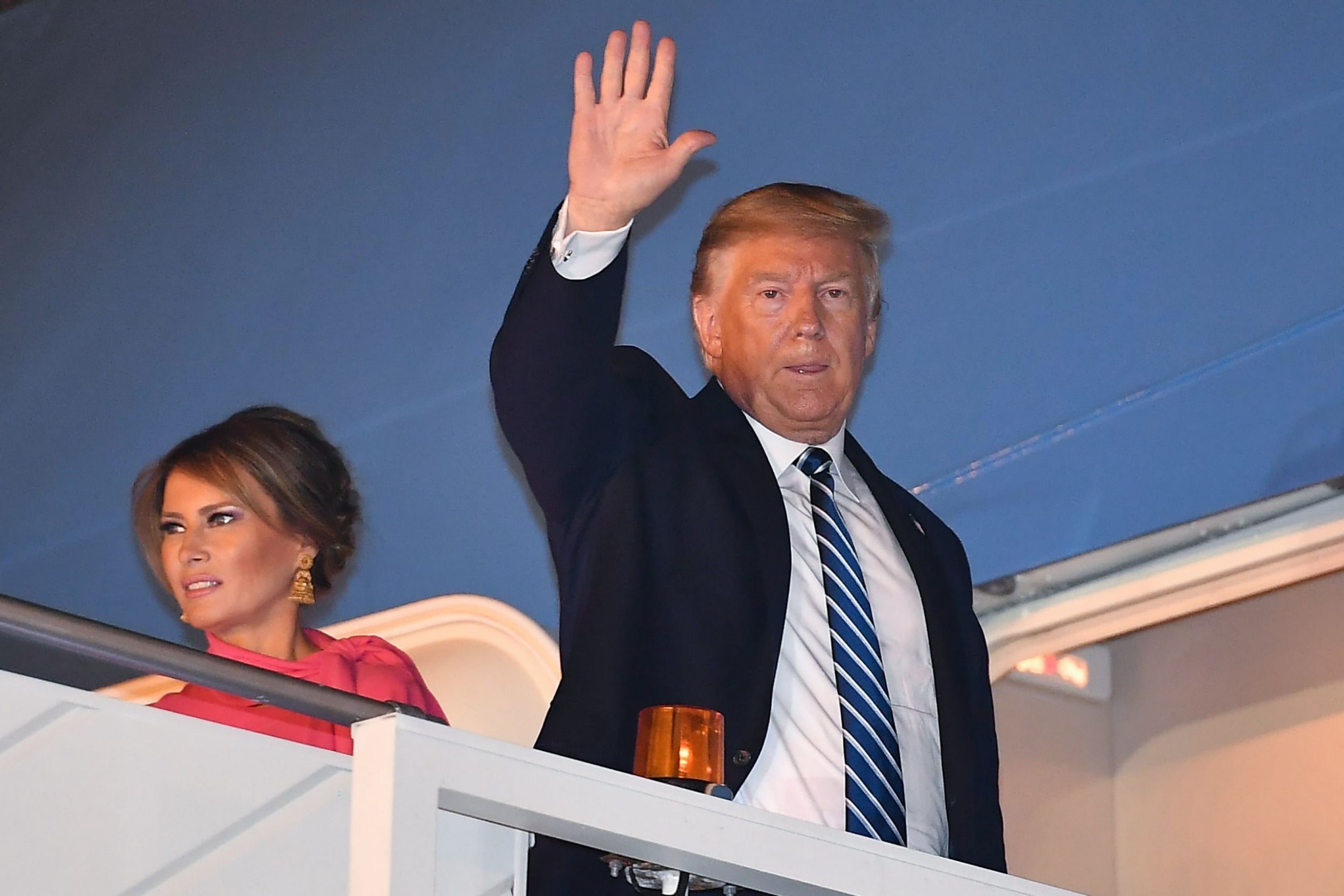 Donald Trump and the first lady board Air Force One in New Delhi at the end of their two-day trip to India