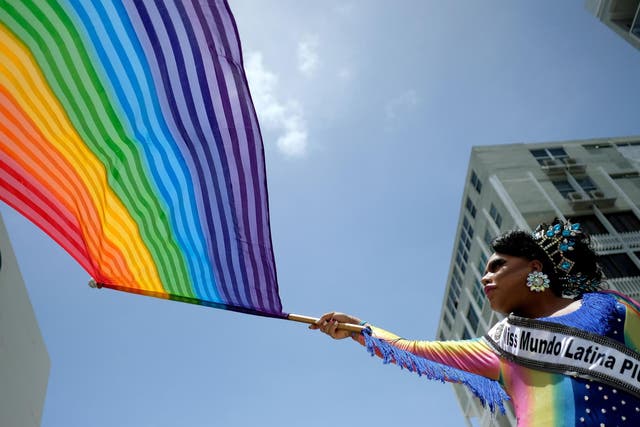People take part in the annual Gay Pride parade in San Juan, Puerto Rico